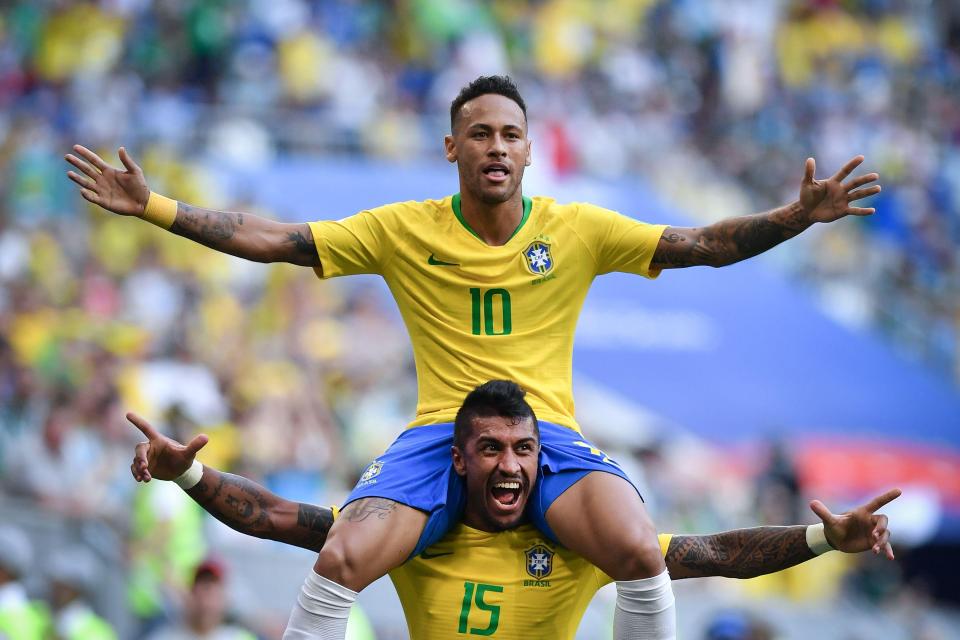  Neymar celebrates with Paulinho after netting against Mexico