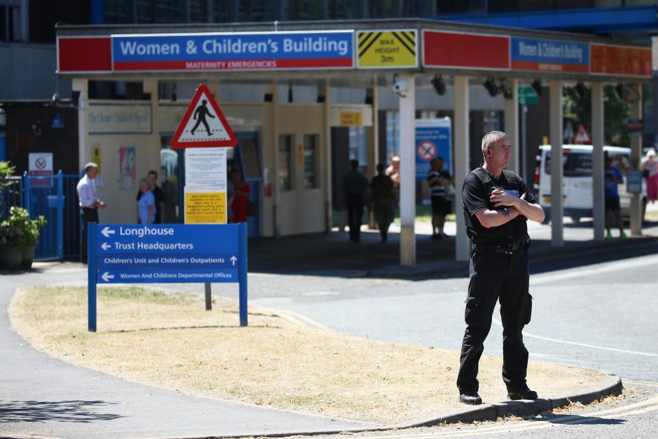  Security guards stood outside the hospital's main gate today