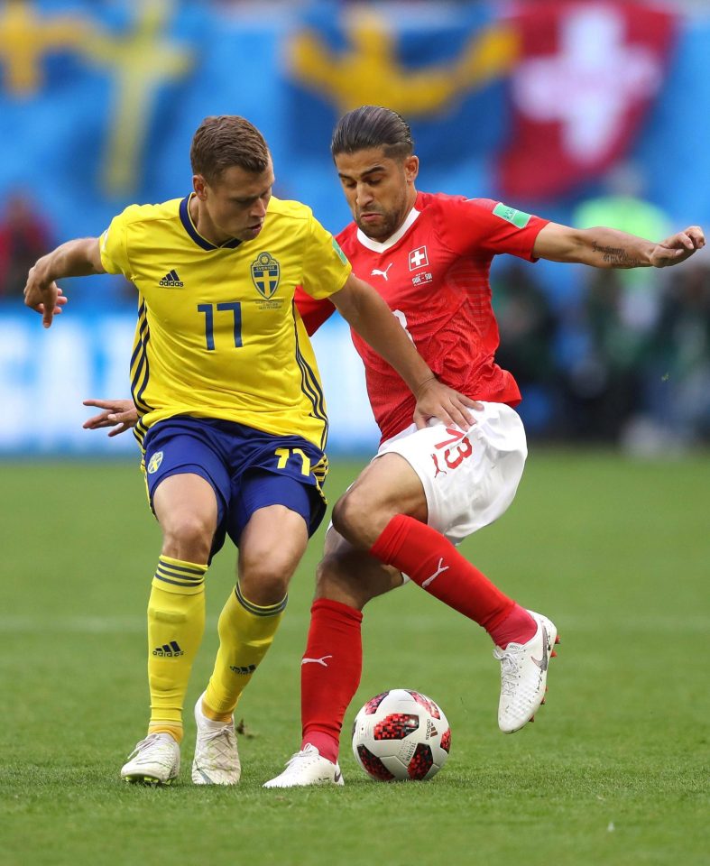  Ricardo Rodriguez and Viktor Claesson vie for the ball during the last-16 clash