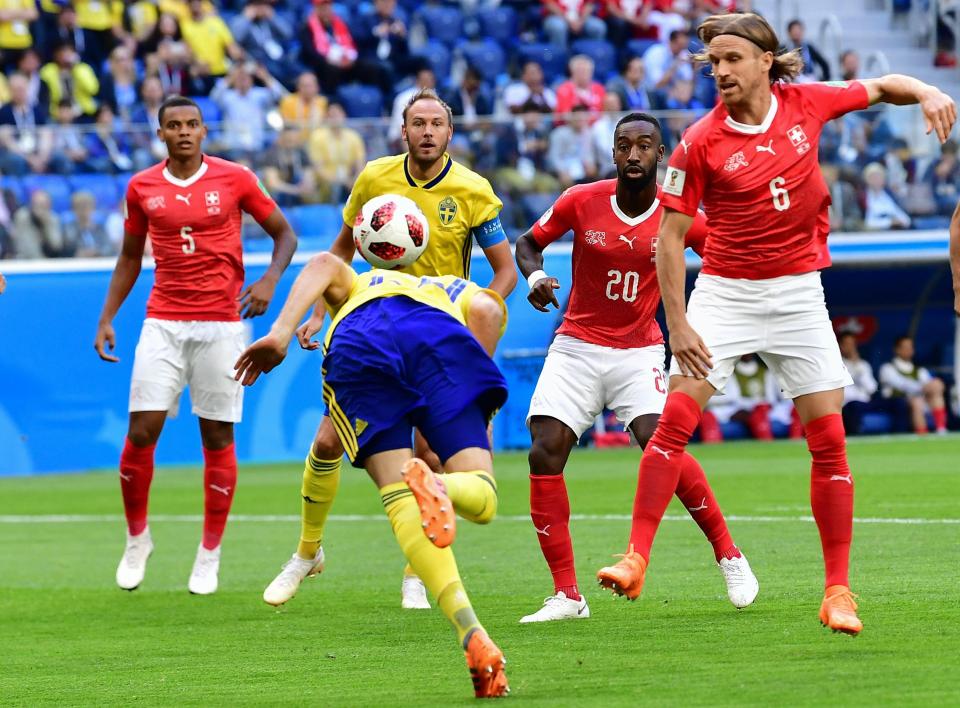  Sweden midfielder Ola Toivonen heads the ball backwards during the match