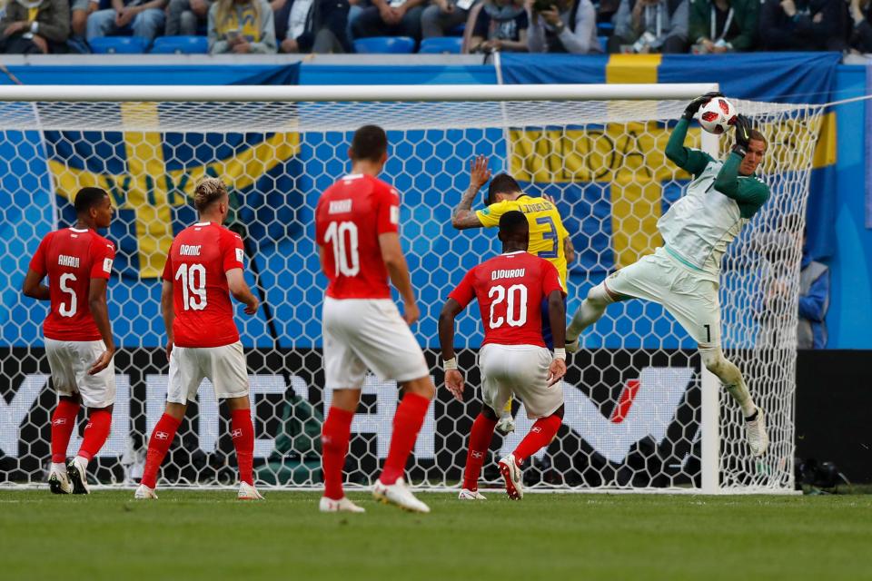  Robin Olsen catches the ball during the first half to keep Switzerland at bay