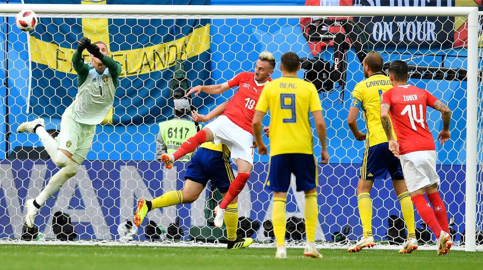  Copenhagen shot-stopper Olsen makes a save during the encounter between the two European nations