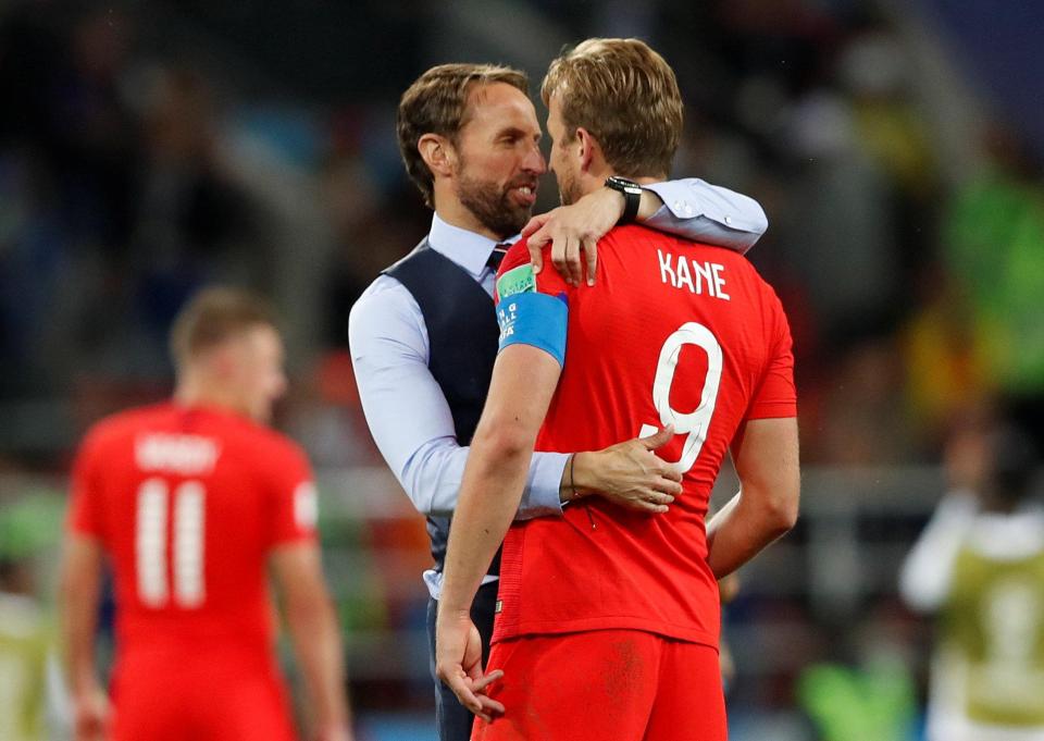  England coach Gareth Southgate celebrates with star man Harry Kane