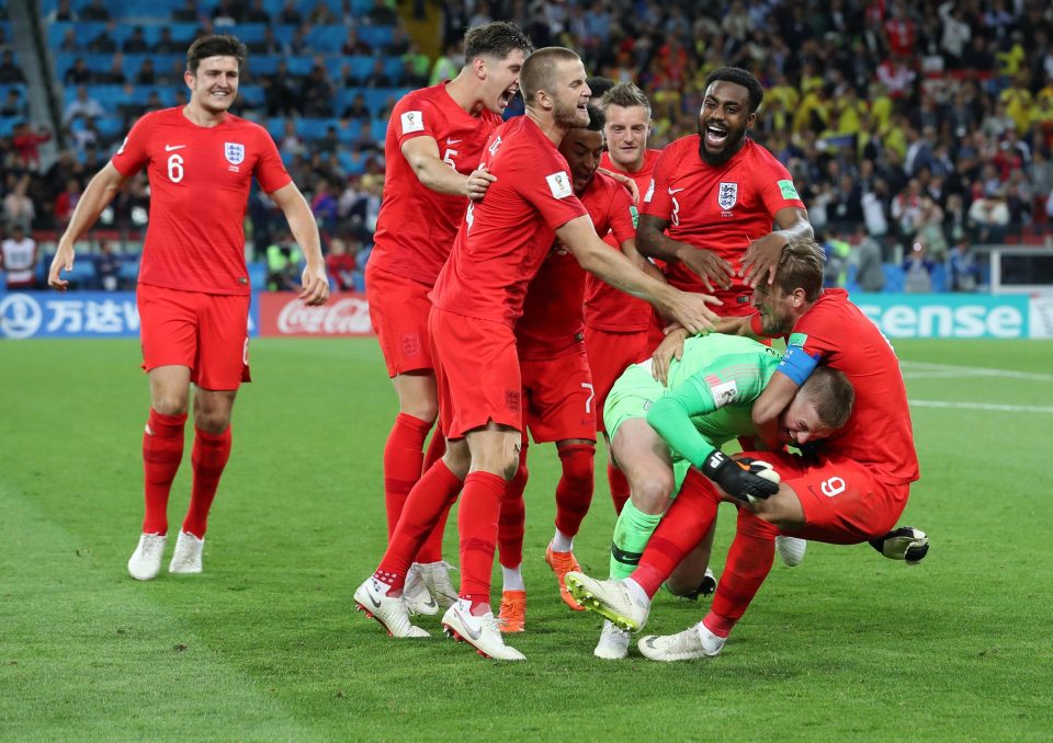  Jordan Pickford is mobbed by his Three Lions team-mates after beating Colombia