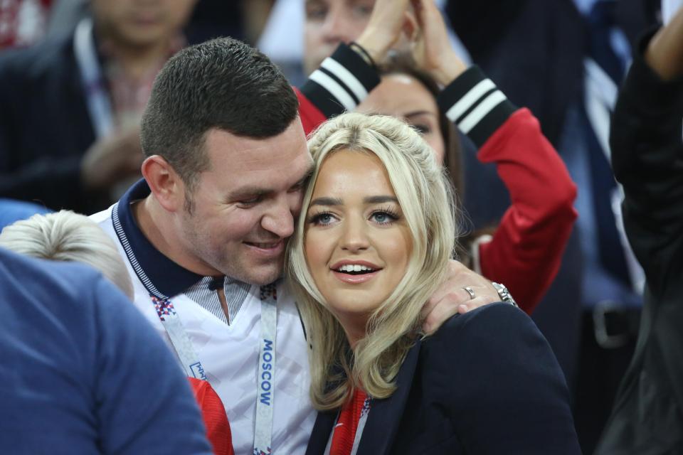  Three Lions support . . . Jordan Pickford's girlfriend Megan watches on from the stands with a fan during tense shootout