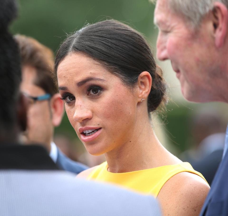 Meghan also returned to her signature low bun up do 