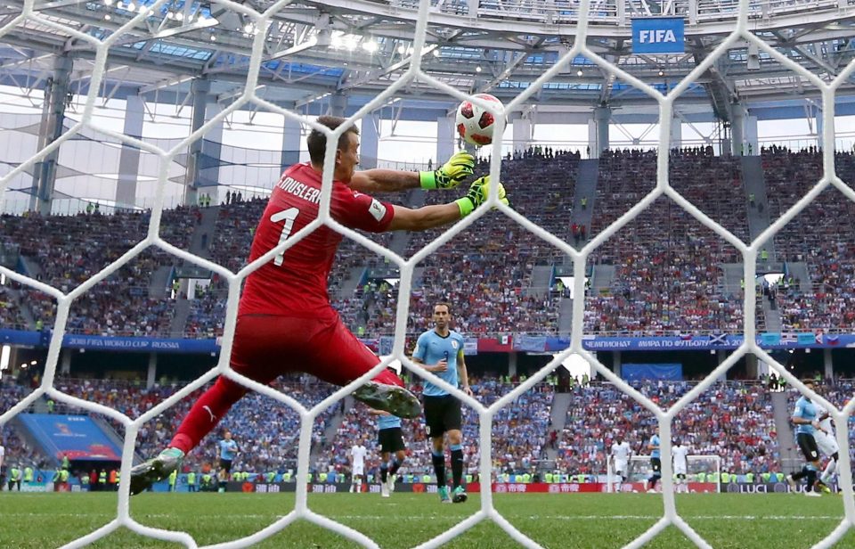  Fernando Muslera gets a dodgy fist to Antoine Griezmann's shot