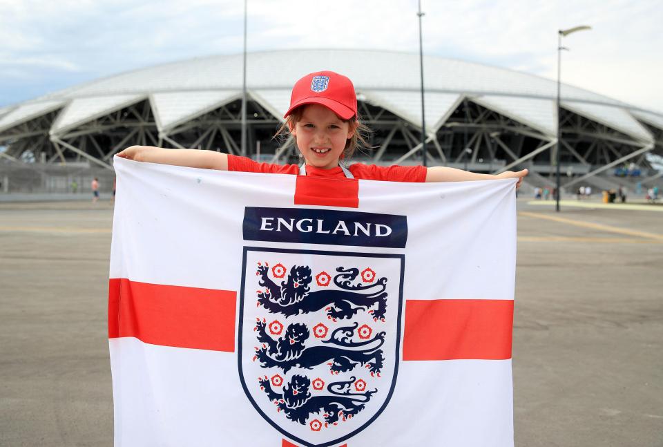  A young England fan shows her support for the team outside the Samara Arena