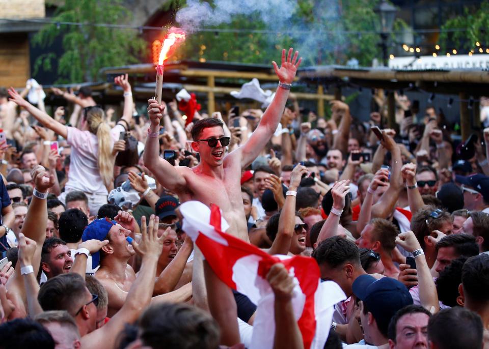  Fans celebrate England's win over Sweden in London's Flat Iron Square