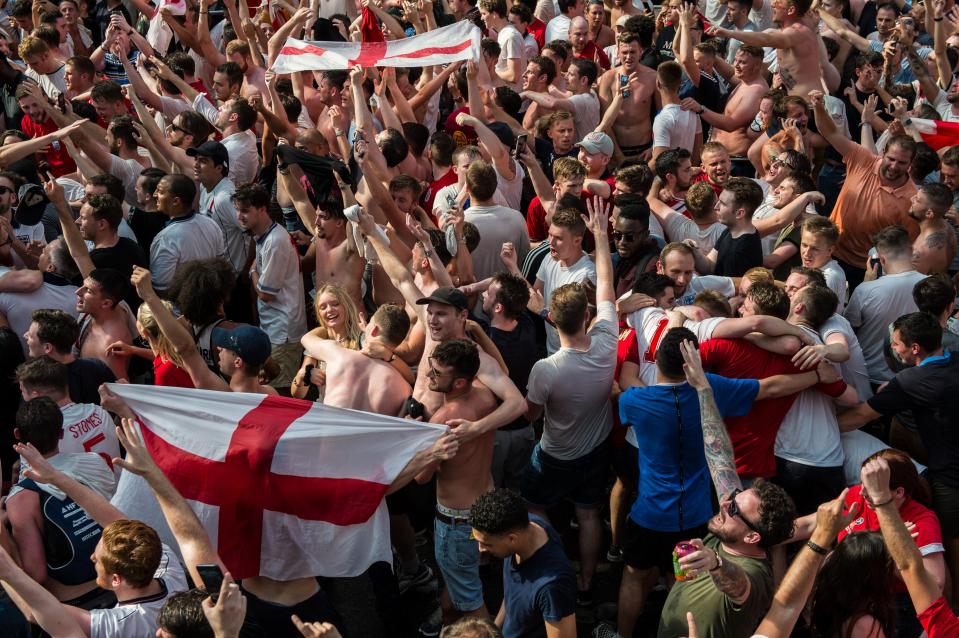  England football fans celebrate at the end of the match after England win in the England V Sweden