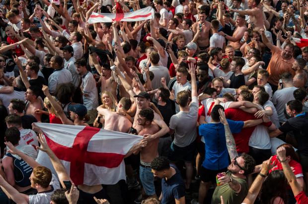 England football fans celebrate at the end of the match after England win in the England V Sweden