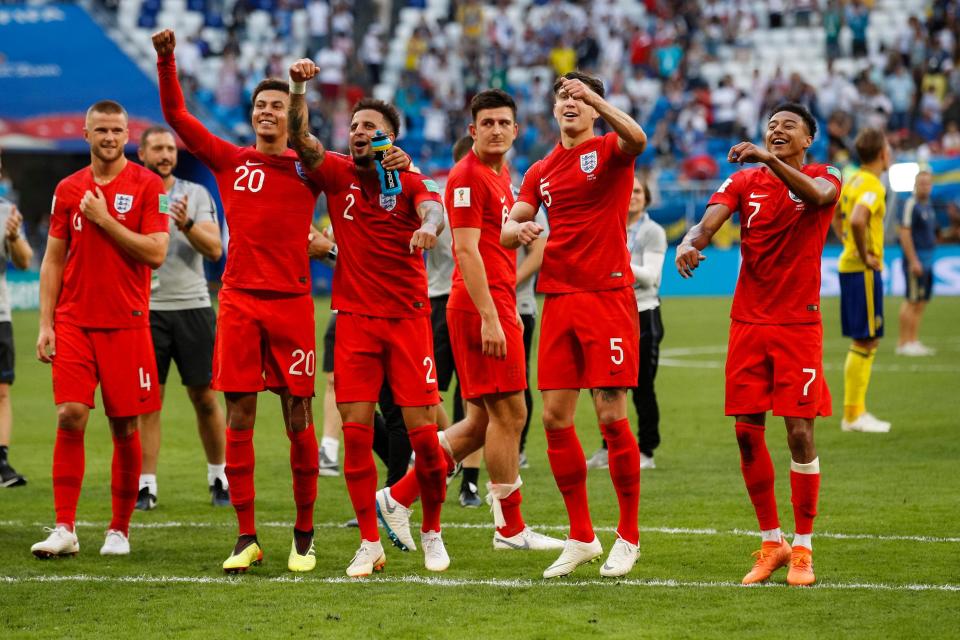 The England players celebrate after beating Sweden in the World Cup quarter-final