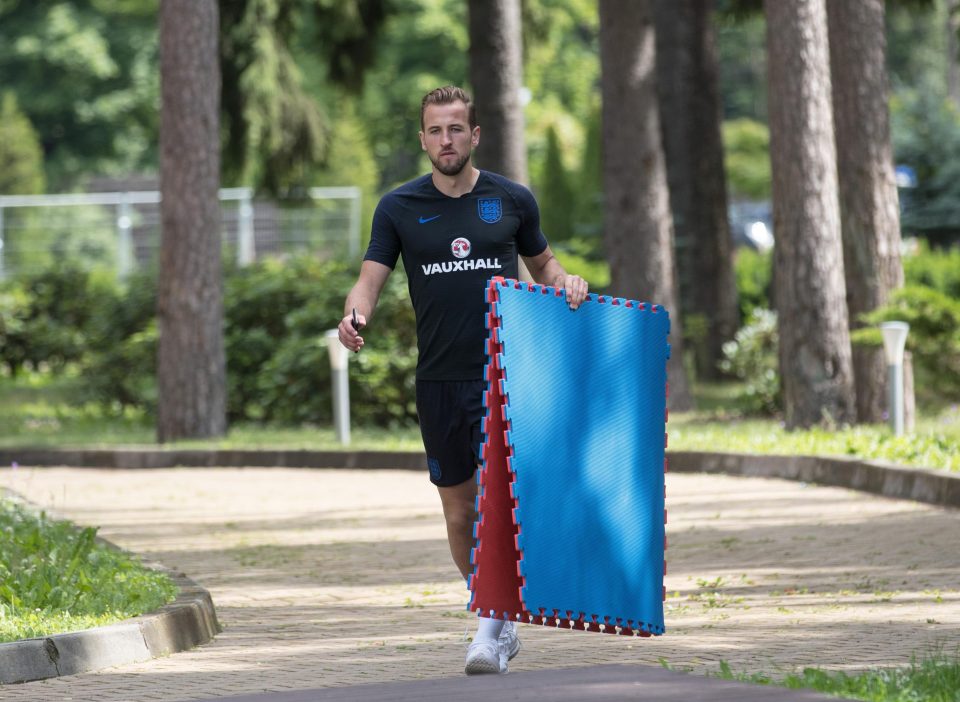  Kane carries some stretching mats as England begin their preparations for their semi-final with Croatia