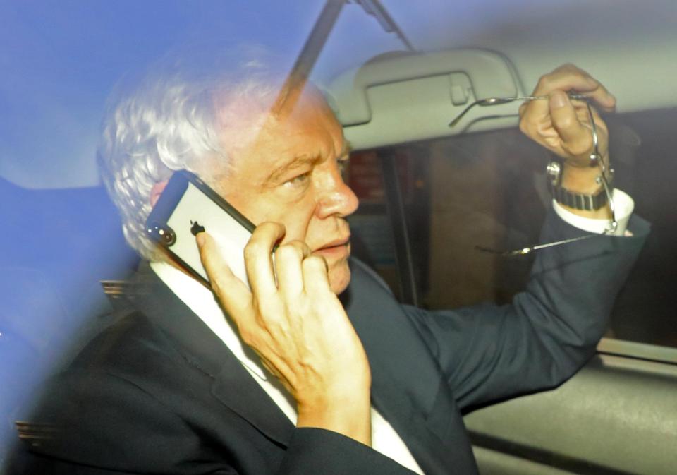  Mr Davis was seen on the phone while leaving the BBC offices