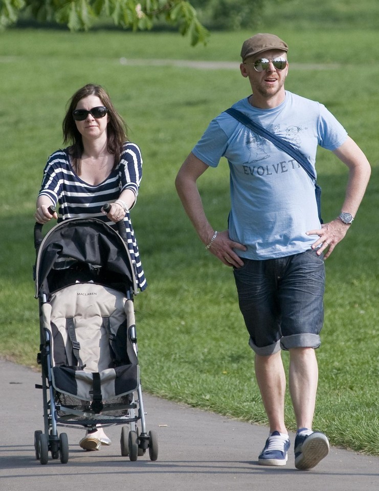 Simon and Maureen taking their daughter for a stroll on Primrose Hill in London