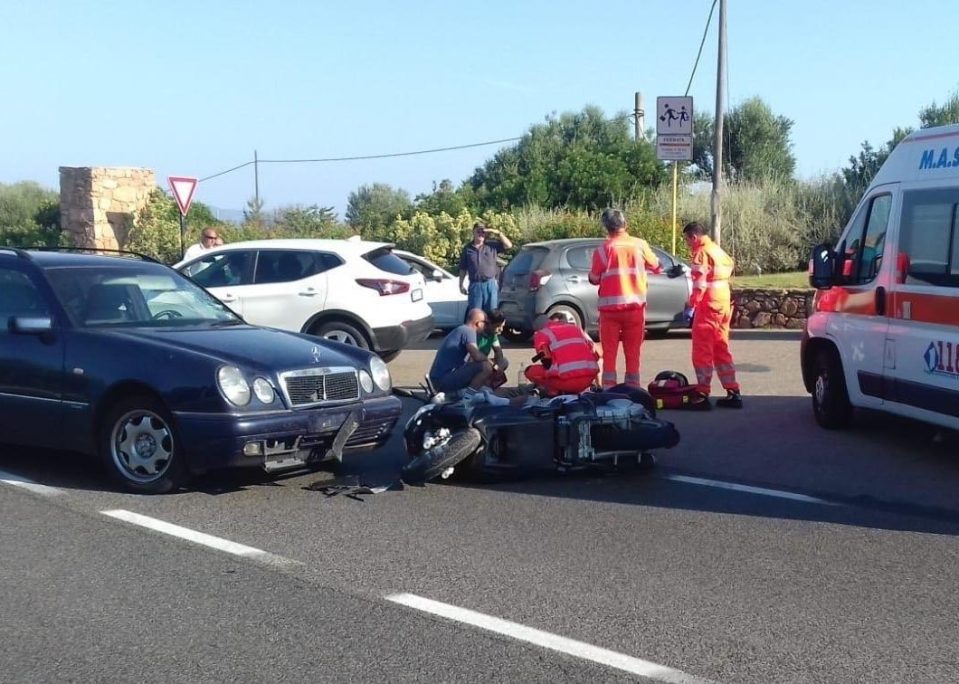 George Clooney was knocked off his scooter and smashed into the windscreen of a Mercedes in Sardinia today. Here medics treat him shortly after the crash