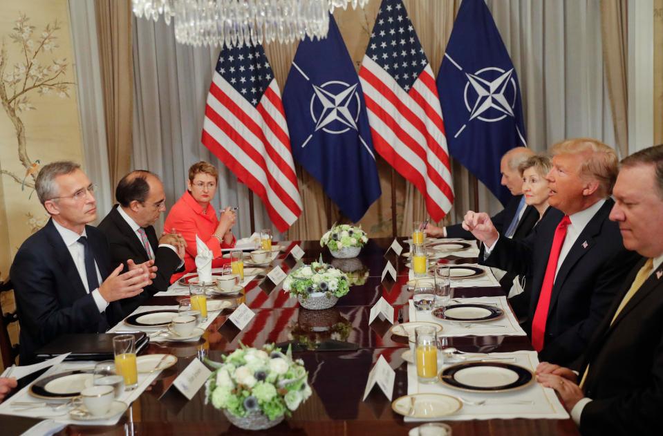  Donald Trump, pictured at a Nato summit breakfast meeting with Jens Stoltenberg where he lashed out at Germany