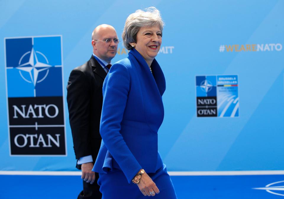  British Prime Minister Theresa May smiles as she arrives