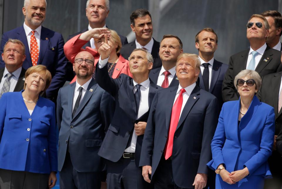  Nato leaders watch a flyover during the official ceremony