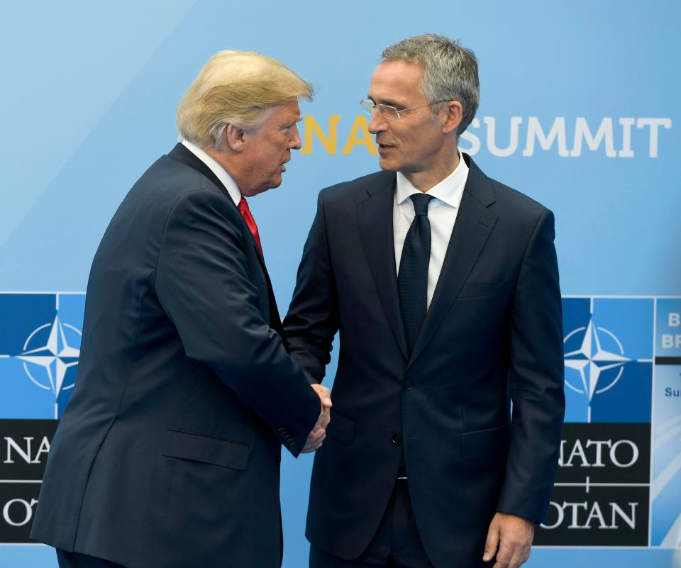  Donald Trump gives Nato chief Jens Stoltenberg a firm handshake