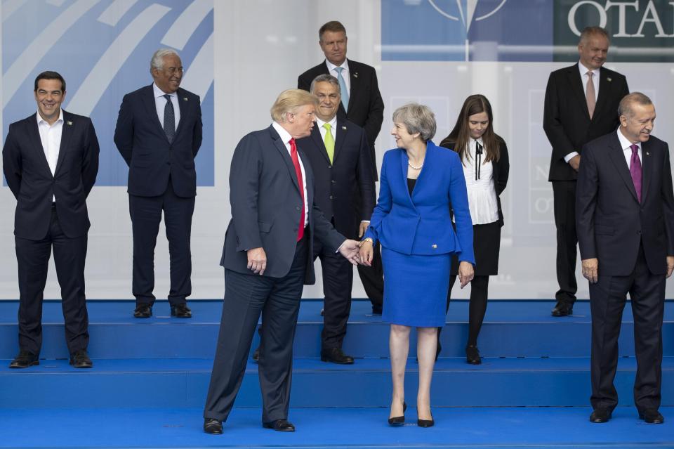  Despite the apparent snub they were later spotted touching hands and acting friendly towards one another during the official NATO photo