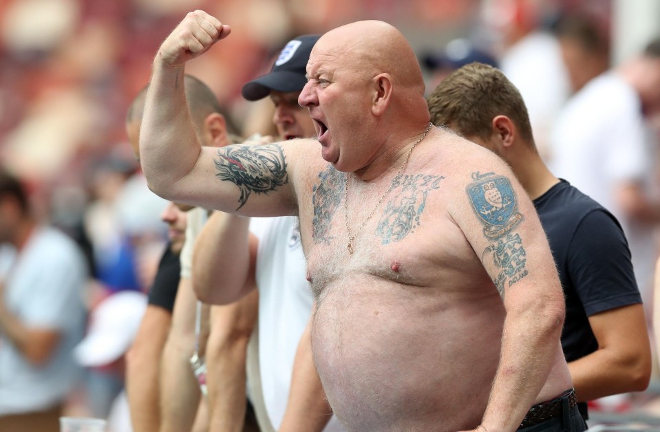 England's biggest fan gets his tattoos out for the fans