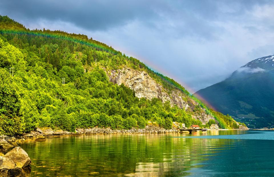  A rainbow peeking up over the hilltop in Lpen