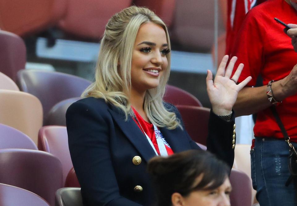 Jordan Pickford's partner Megan Davison gives the players a wave as she takes her seat in the stands