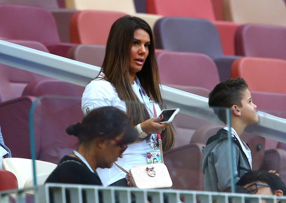 Becky Vardy takes her seat in the stands after flying in to Moscow