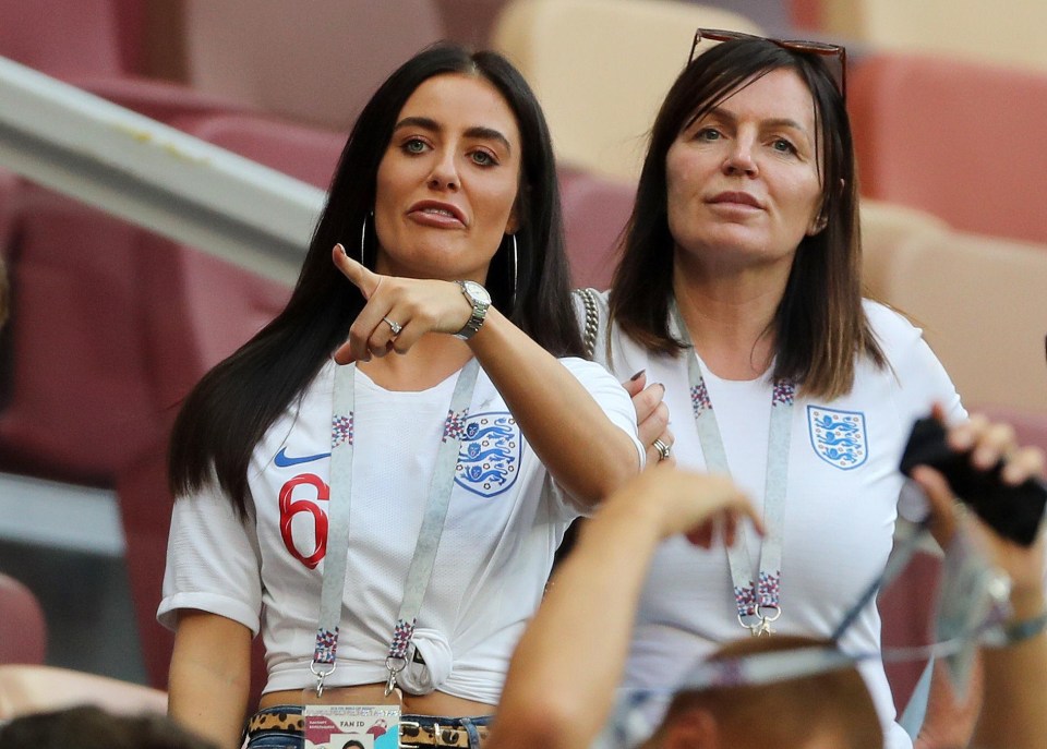 Fern Hawkins tries to spot her partner Harry Maguire on the pitch