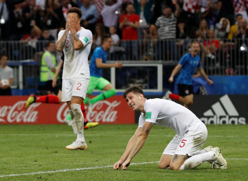 Kyle Walker and John Stones are distraught after Mandzukic scored the winning goal for Croatia