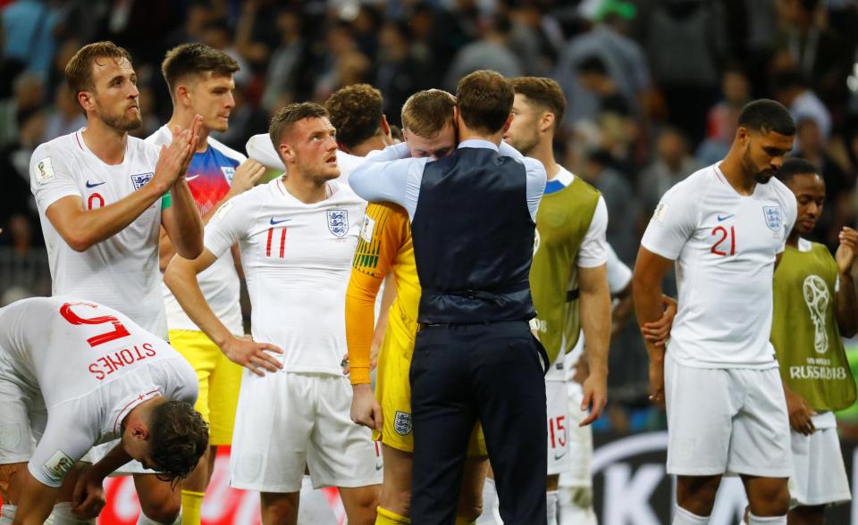 Gareth Southgate consoles his dejected players as they came up short against Croatia