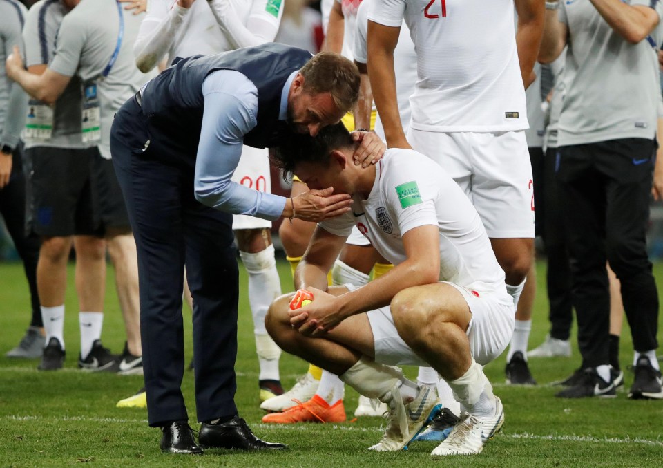 Gareth Southgate tries to console a shattered Harry Maguire after the whistle