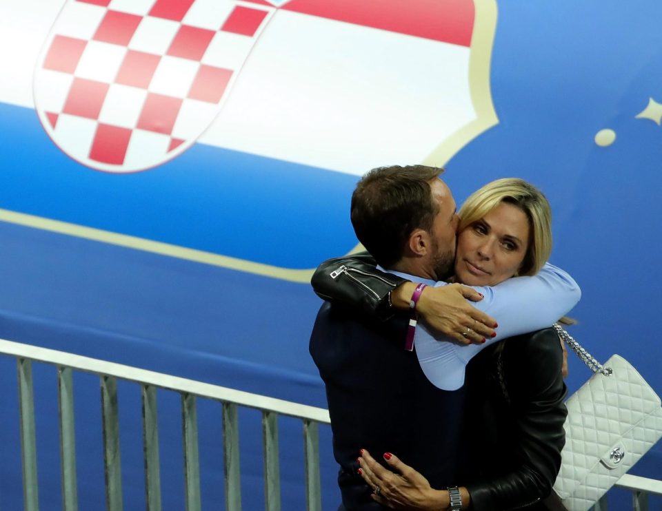  The Three Lions boss and his wife hug after England's World Cup exit