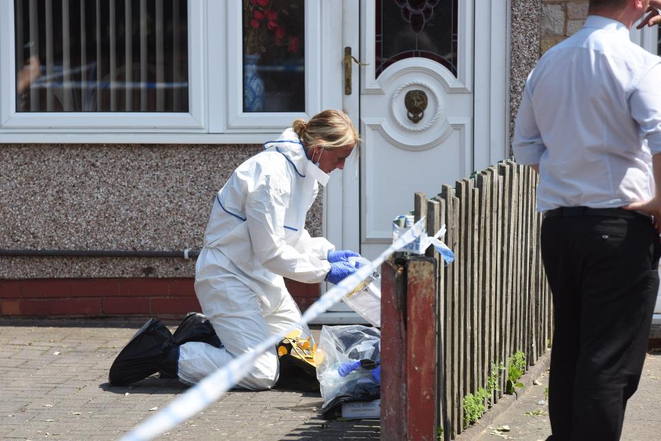  Forensics scoured the scene for clues after the woman was fatally stabbed