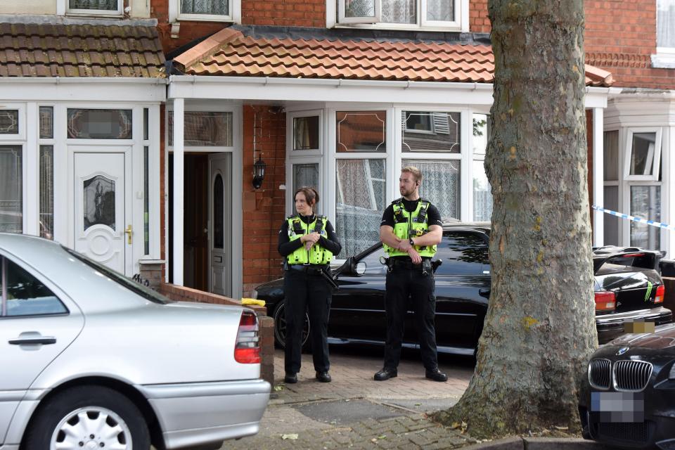  Police stand guard at the scene as they piece together what happened