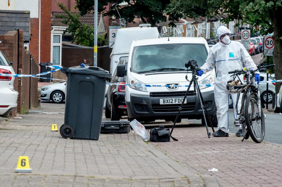  Forensic officers have placed markers at the scene as they examined clues