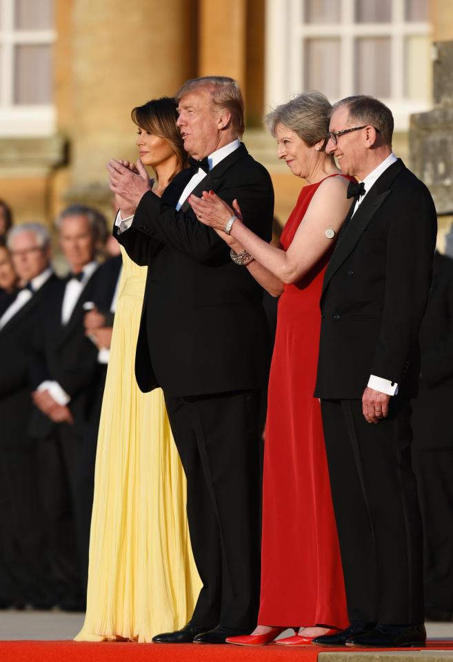  Theresa May and Donald Trump stand with Philip May, right, and Melania Trump, left , at the steps of Bleinheim Palace, Oxfordshire