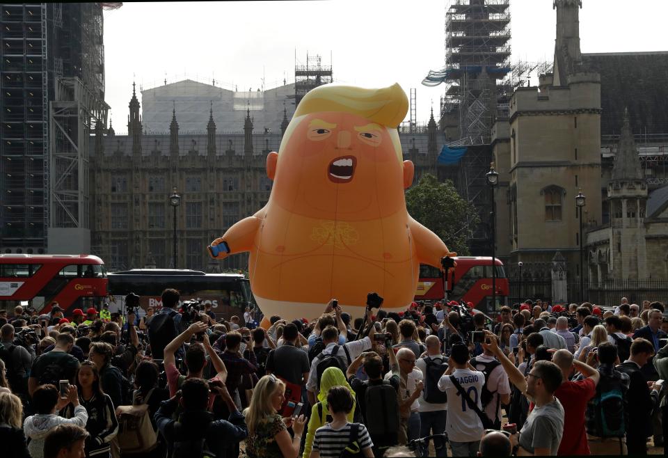  A small crowd gathered to see the Trump blimp raised into the air this morning