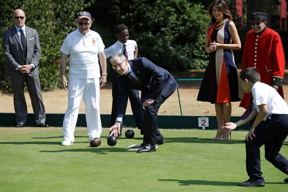  Mr May also had his turn on the bowls as well, cheered on by Melania on the sidelines