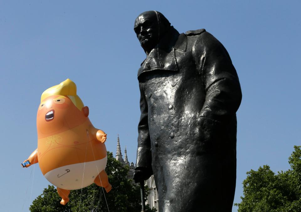  The Trump balloon hovers next to the statue of former British Prime Minister Winston Churchill