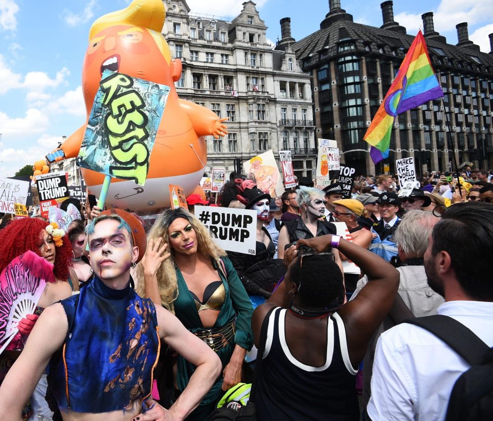  The 20ft balloon was carried aloft by a team of 'babysitters' wearing red baseball caps mocking the president's Make America Great Again slogan