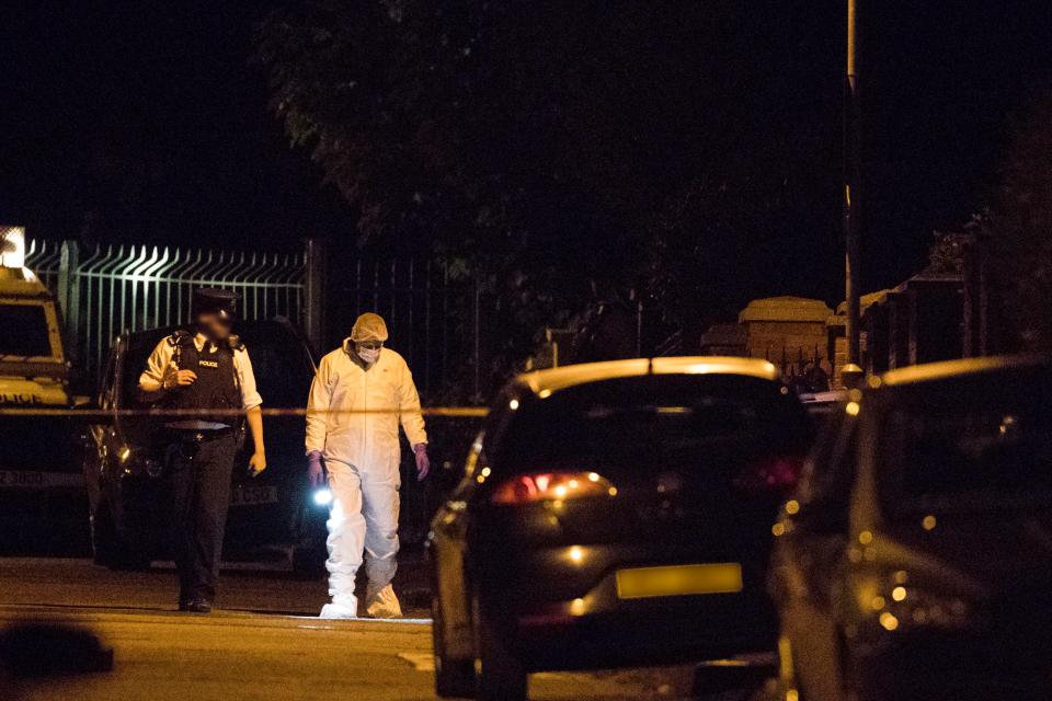  Police outside the west Belfast home of former Sinn Fein president Gerry Adams