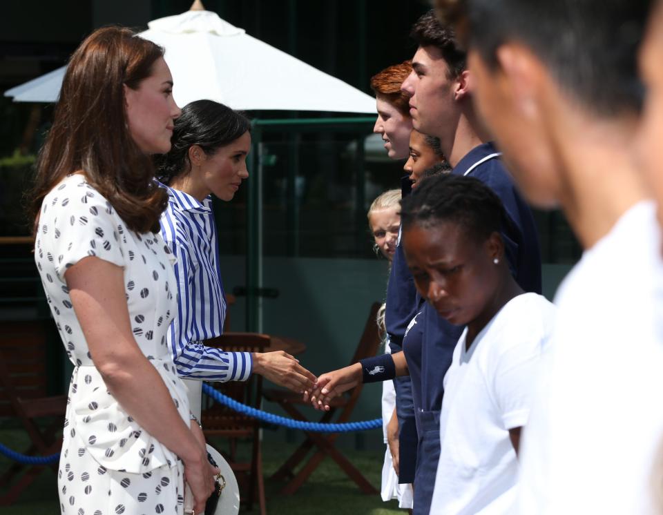  Kate and Meg shook hands and chatted to ball boys and girls at Wimbledon