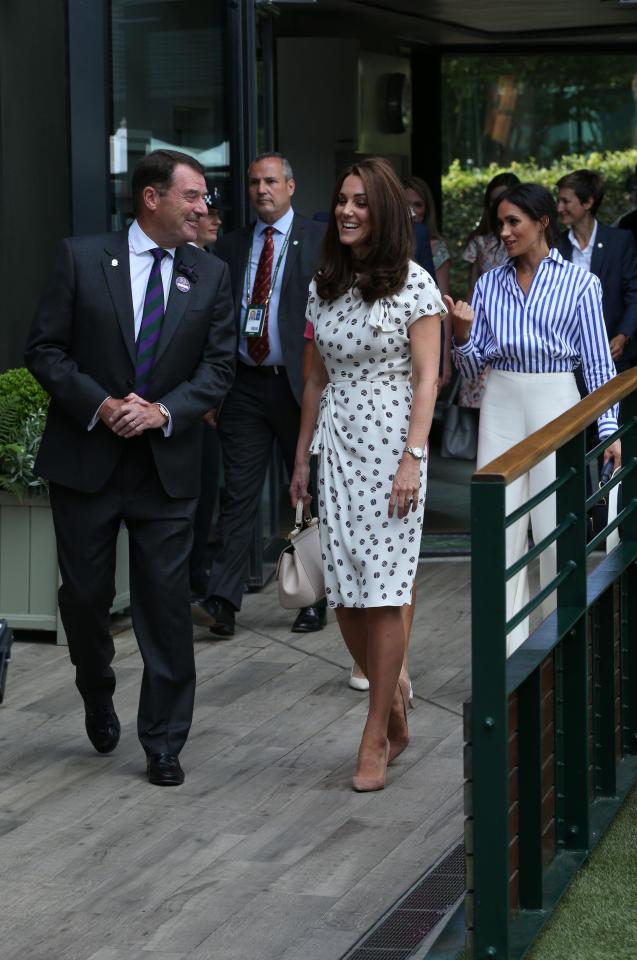  Kate teamed her fitted midi dress with a pair of nude heels as she chatted happily to officials