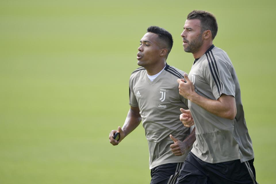 Alex Sandro, left, has been back in training with Juventus after failing to get into the Brazil squad for the World Cup