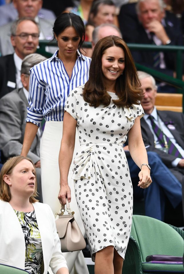  Feeling pretty ace... Meghan and Kate take their seats in Centre Court