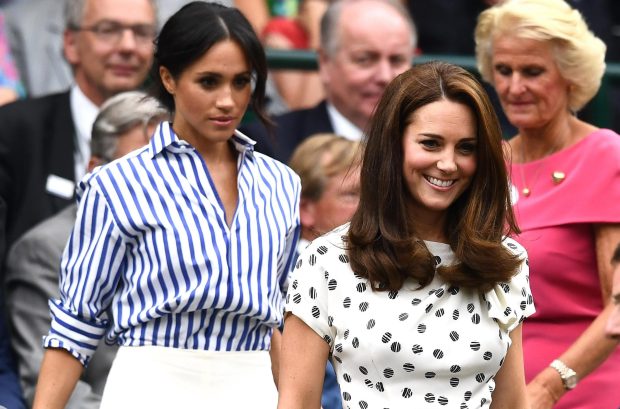 Meghan Markle and Kate Middleton make their way into the Royal Box