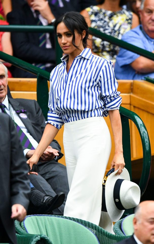  Meghan teamed her loose-fitted shirt with a wide-legged white trousers