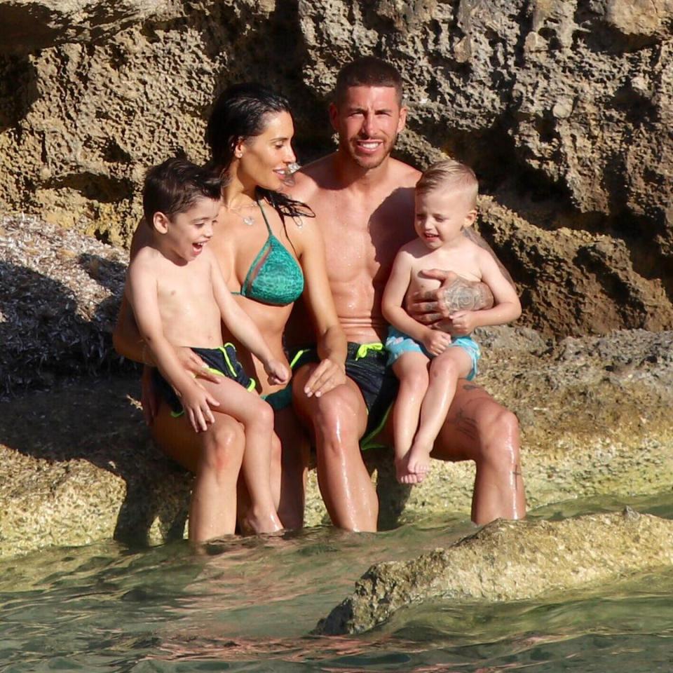 Sergio Ramos poses for a photo with stunning wag Pilar Rubio and his two sons Sergio Ramos Jr and Marco